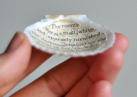 holding a sea shell with poems inside