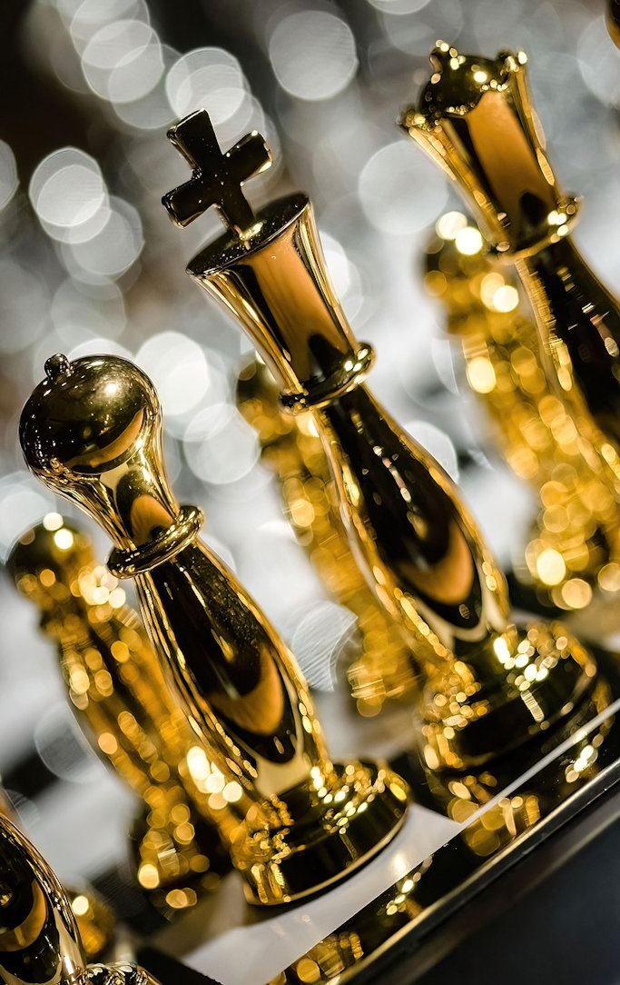 Gold chess pieces on a board