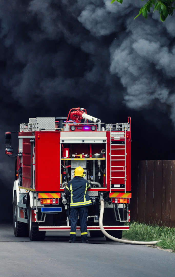 Fire truck pictured with a smokey background